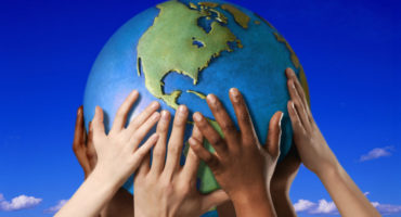 Hands on a globe